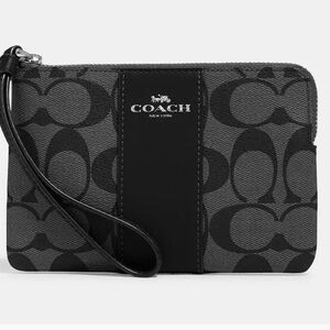 Classic Coach Corner Zip Wristlet in Signature Canvas.